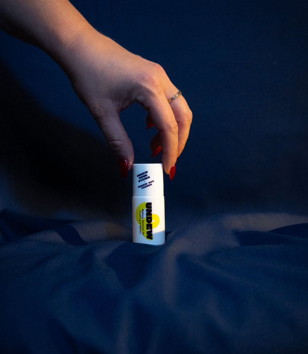 Undew portable makeup stain remover pen in beauty flatlay